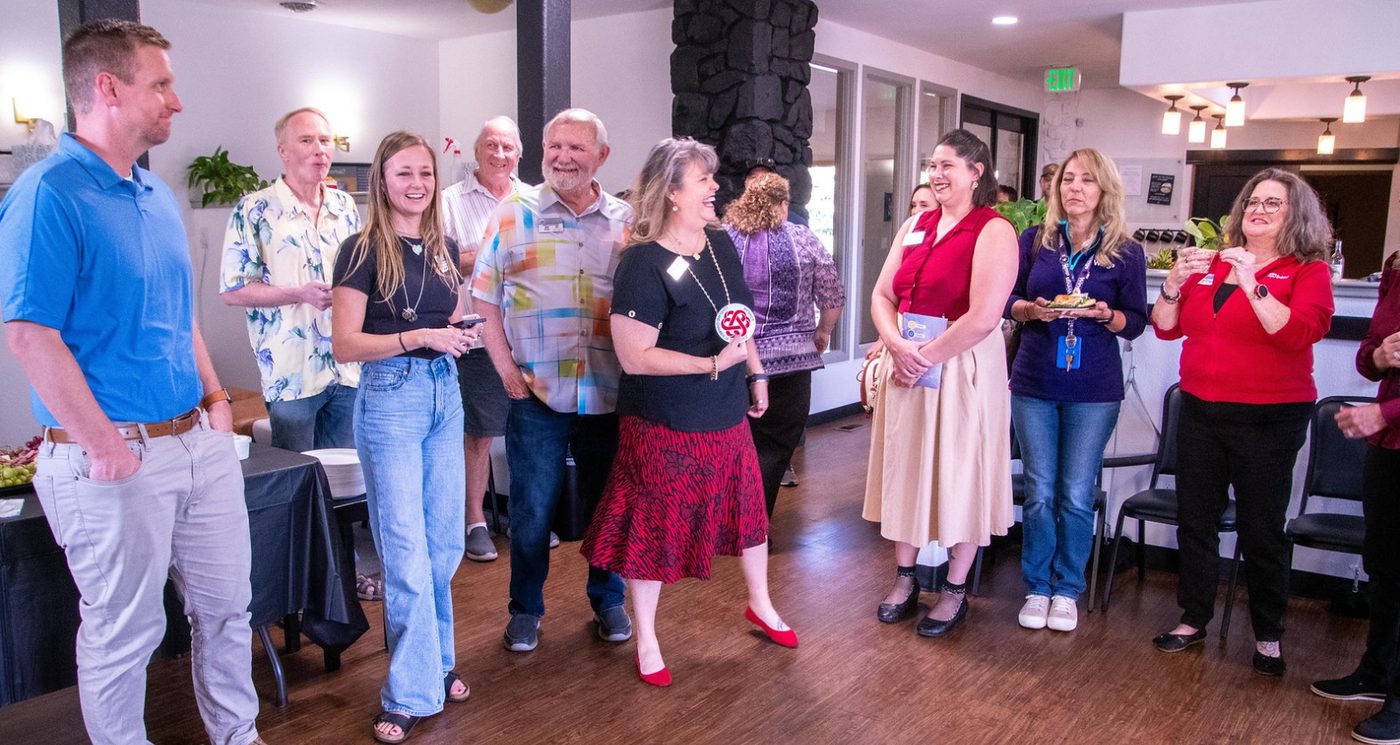 Guests gathered inside Aligned and Well Chiropractic in Loveland after the Chamber ribbon cutting