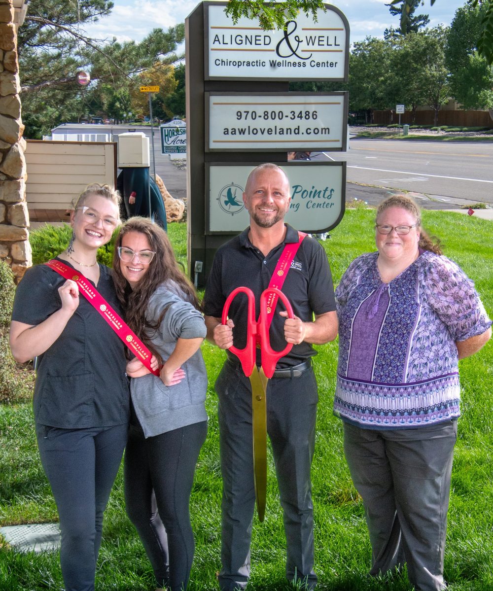 The Aligned and Well Chiropractic team at the Loveland Chamber of Commerce ribbon cutting: Emily Ferguson, Rannien Gray, Dr. Brian Flemming and Mildred